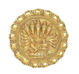 Close-up brass Panchmukhi Ganesha relief in ornate circular border