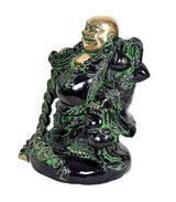 Gold and green laughing Buddha statue on base, side view with robe details