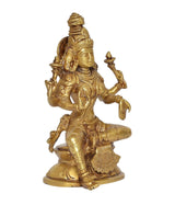 Brass Lakshmi statue, three-quarter view, seated on lotus base with raised hands