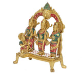 Ram Darbar idol side view: three figures in colorful outfits with staffs under arch