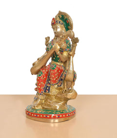 Saraswati goddess figurine side view, green drape and red dress with veena on peacock base