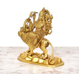 Three-quarter view of golden brass Durga Maa seated on lion, 9 inch