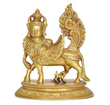 Brass Kamadhenu cow with wings idol, front view on decorative round pedestal