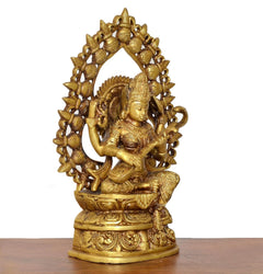 Brass Saraswati statue, angled view with detailed halo and seated draped ornaments