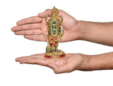 Brass Vishnu four-armed idol held in hands, 7.5 inch standing figure with painted jewelry
