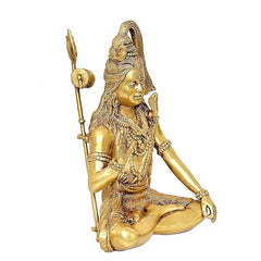 Brass Shiva statue seated, trident staff upright and intricate ornaments