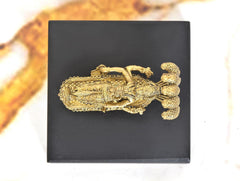 Gold tone Vishnu reclining on Sheshanaag, close rear view on black base