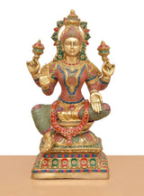 Lakshmi brass idol front view, raised hands and lotus-seated body with jeweled details