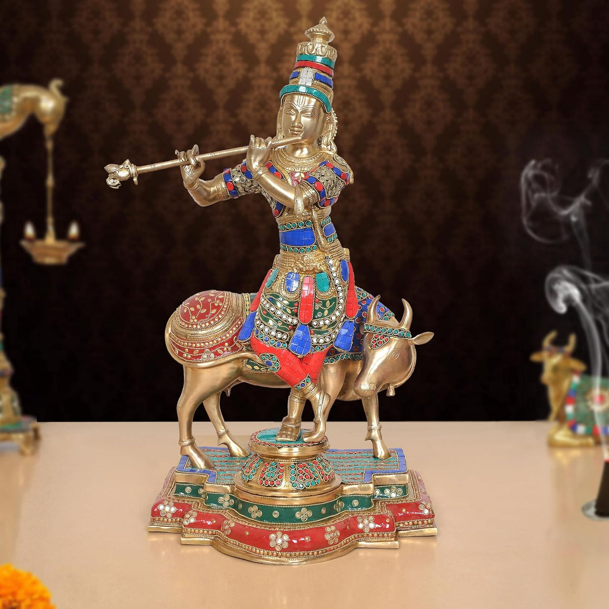 Brass Lord Krishna figurine on cow idol, multicolor detailing, raised sword pose