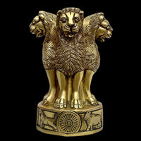 Brass Ashoka Stambh emblem memento, close-up lion figure on round wheel pedestal