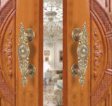 Brass door handle pair, golden ornate leaf and sunburst medallion details