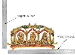 Metal idol with peacock arch frame, Ganesh Laxmi Saraswati; height 6 in, width 12.5 in