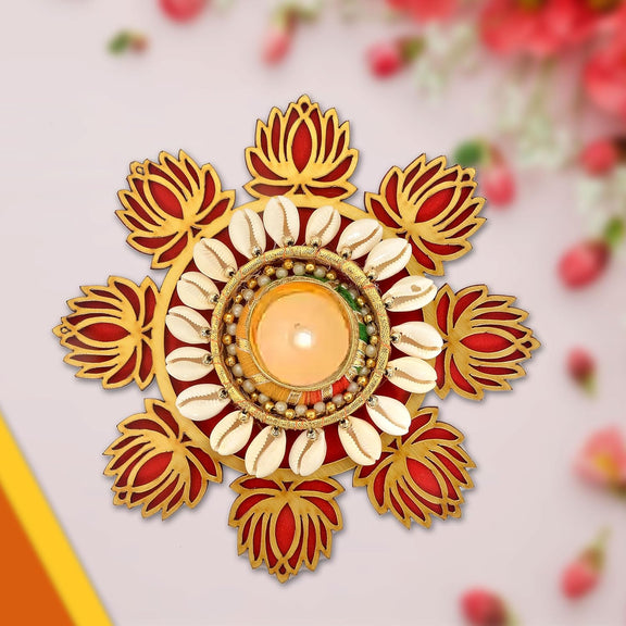 Decorative diya tea light holder with red lotus petals, cream shells, and gold-rim candle well