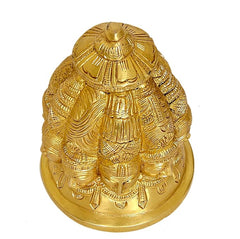 Brass Shiva stupa idol from side view, nine faces and ornate patterns