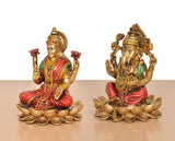 Resin Lakshmi and Ganesh figurines on lotus, three-quarter view, ornate painted outfits