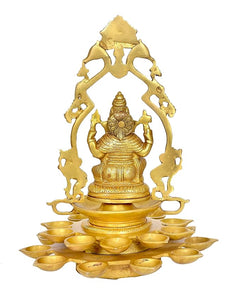 Brass Ganesha diya lamp idol with arched halo, 20 diya holders, close-up