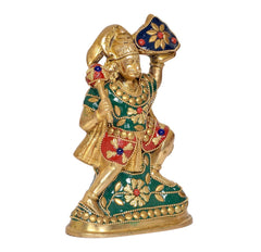 Brass Hanuman idol statue angled view, 6-inch, ornate jewelry and green dress