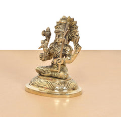 Golden Kamakshi Amman statue, side view of seated deity holding a tall staff
