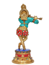 Brass Krishna flute idol statue, back view with teal outfit and red jewel panels