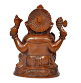 Ganesha idol statue, back view with carved halo and raised arms, bronze finish
