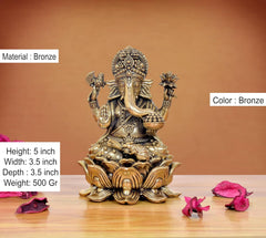 Bronze Lord Ganesha murti, 5 inch tall, seated with four arms and lotus base