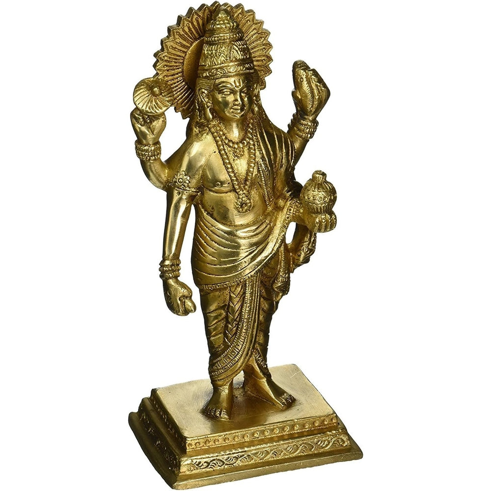 Brass Dhanvantari statue with raised hands and ornate halo, on base