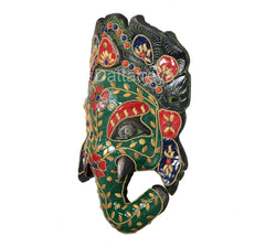 Ganesha metal wall mask angled view, ornate temple decorations and dangling accents