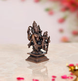 Copper-toned Lakshmi Narasimha statue (3 inch), side view with raised hand details