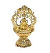Gold brass Ganesh diya oil lamp, central deity with decorative circular frame