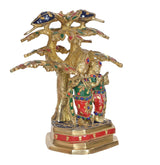Brass Radha Krishna flute idol under tree, close front view of two figures