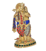 Brass Radha Krishna idol holding flute, red and blue jeweled patterns, standing pose