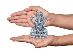 Brass Ganesha idol on lotus base held in hands, small 4 in size