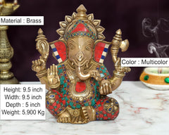 Brass Ganpati Bappa murti, multicolor decorated crown and jewelry, seated pose