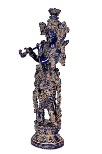 Krishna idol figurine side view, blue tones with engraved brass patterns, standing