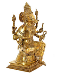 Golden eight-armed Varahi goddess idol figurine, seated with raised arms and base