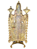 Back view of brass Tirupati Balaji idol with embossed detailing and hanging ornaments