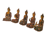 Five brass cosmic Buddha statues from an angled view, seated with detailed robes