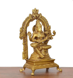 Three-quarter brass Saraswati goddess idol with raised hands, arched halo, veena