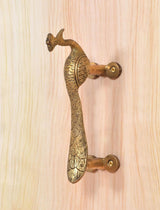 Gold brass peacock door handle, curved body and beak detail with screw mounts