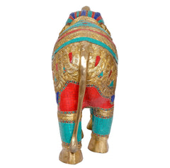 Brass elephant statue rear view, teal and red patterned body with gold detailing