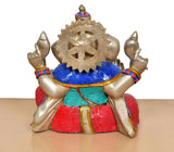 Brass Ganpati Bappa murti back view with blue-black halo, red draped skirt, gold details