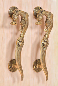 Golden brass pair door handles with engraved yali patterns and lion head accents