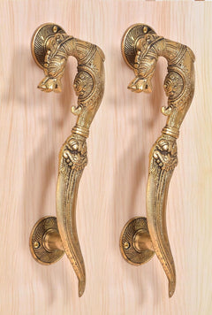 Golden brass pair door handles with engraved yali patterns and lion head accents