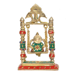 Brass Ganesha swing jhula with seated figure, gold frame, and multicolor ornaments