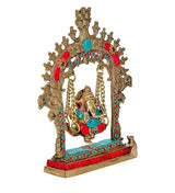 Brass Ganesha swing statue idol, angled view showing turquoise base and red trim