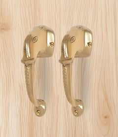 Golden brass Ganesha face door handle pair, matching curved handles