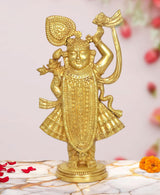 Brass Shreenathji statue, golden figure with halo, flute, raised arm on round base