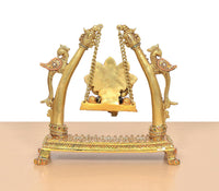 Brass Ganesha swing idol close view with ornate chains and decorative pedestal