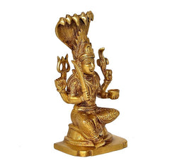 Gold brass Durga Mariamman idol angled view, four arms raised, seated on rectangular base