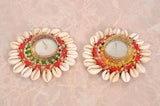 Two Diwali tea light holders: green-red and orange-red bead trim, gold mesh centers, shells